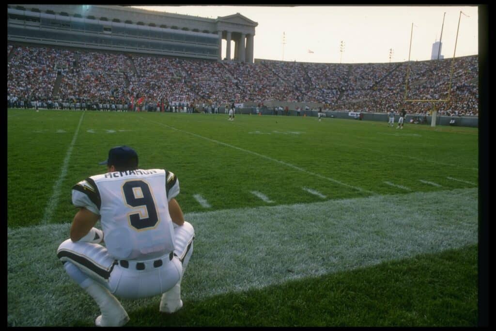 Quarterback Jim McMahon of the San Diego Chargers looks on during a game against the Chicago Bears at Soldier Field in Chicago, Illinois. 