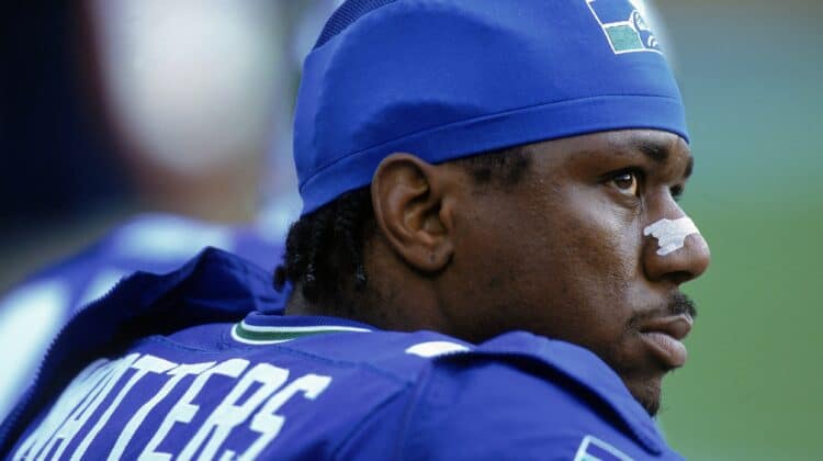 Ricky Watters #32 of the Seattle Seahawks looks on from the bench during a game against the Carolina Panthers at the Ericsson Stadium in Charlotte, North Carolina. The Panthers defeated the Seahawks 23-3.