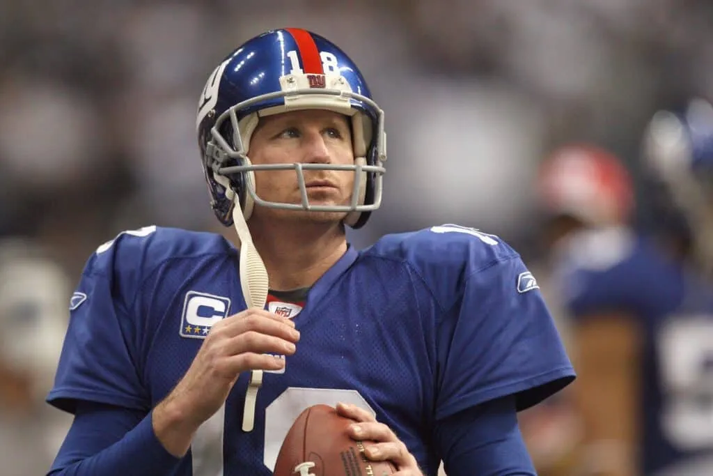 Punter Jeff Feagles #18 of the New York Giants looks to the boards