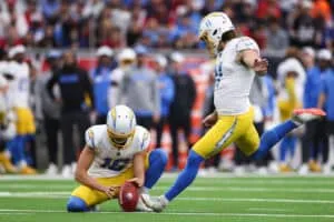 HOUSTON, TEXAS - JANUARY 11: Cameron Dicker #11 of the Los Angeles Chargers kicks a field goal against the Houston Texans in the first quarter during the AFC Wild Card Playoffs at NRG Stadium on January 11, 2025 in Houston, Texas.